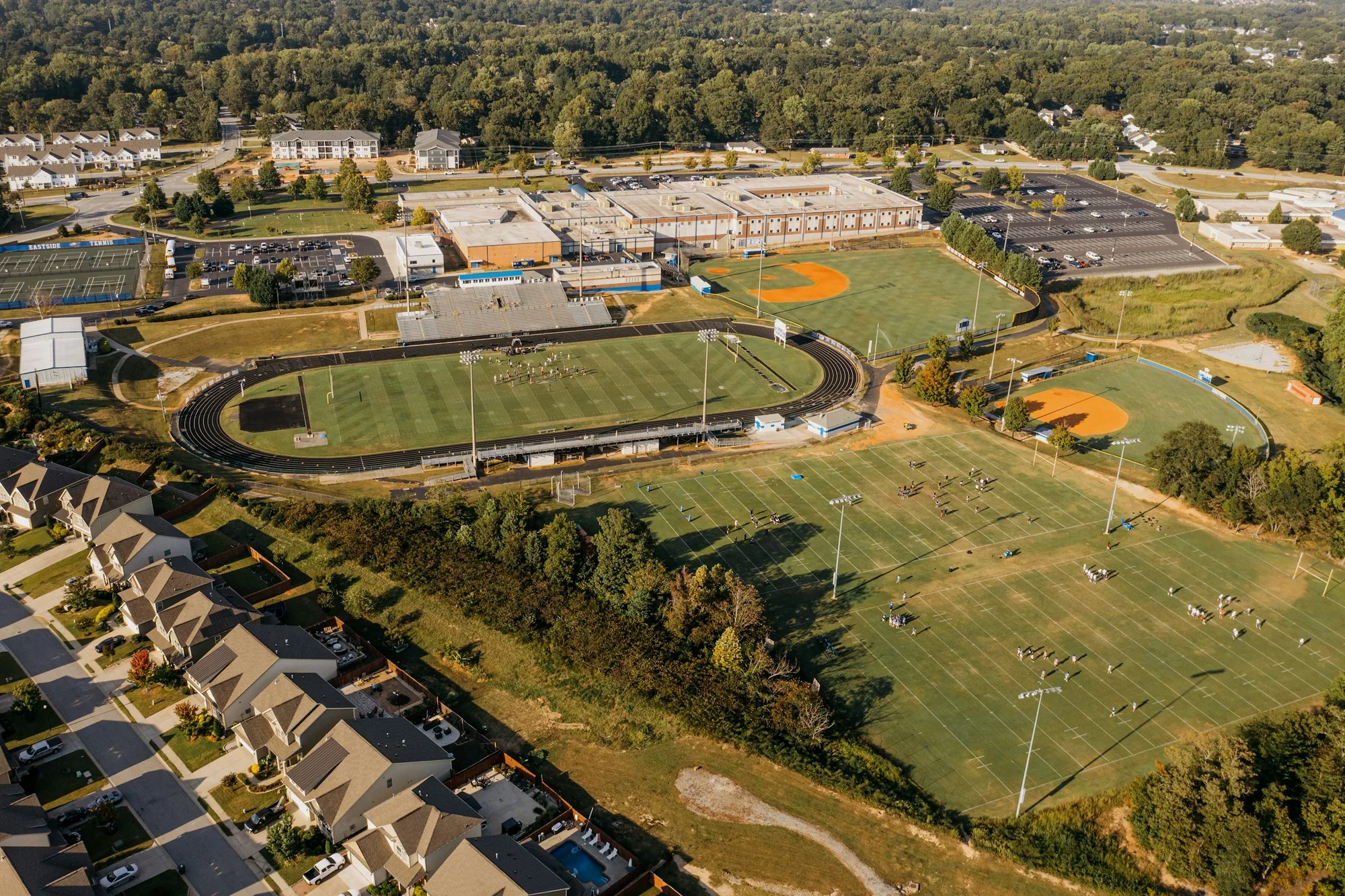 Aerial view of an educational campus and its surrounding fields